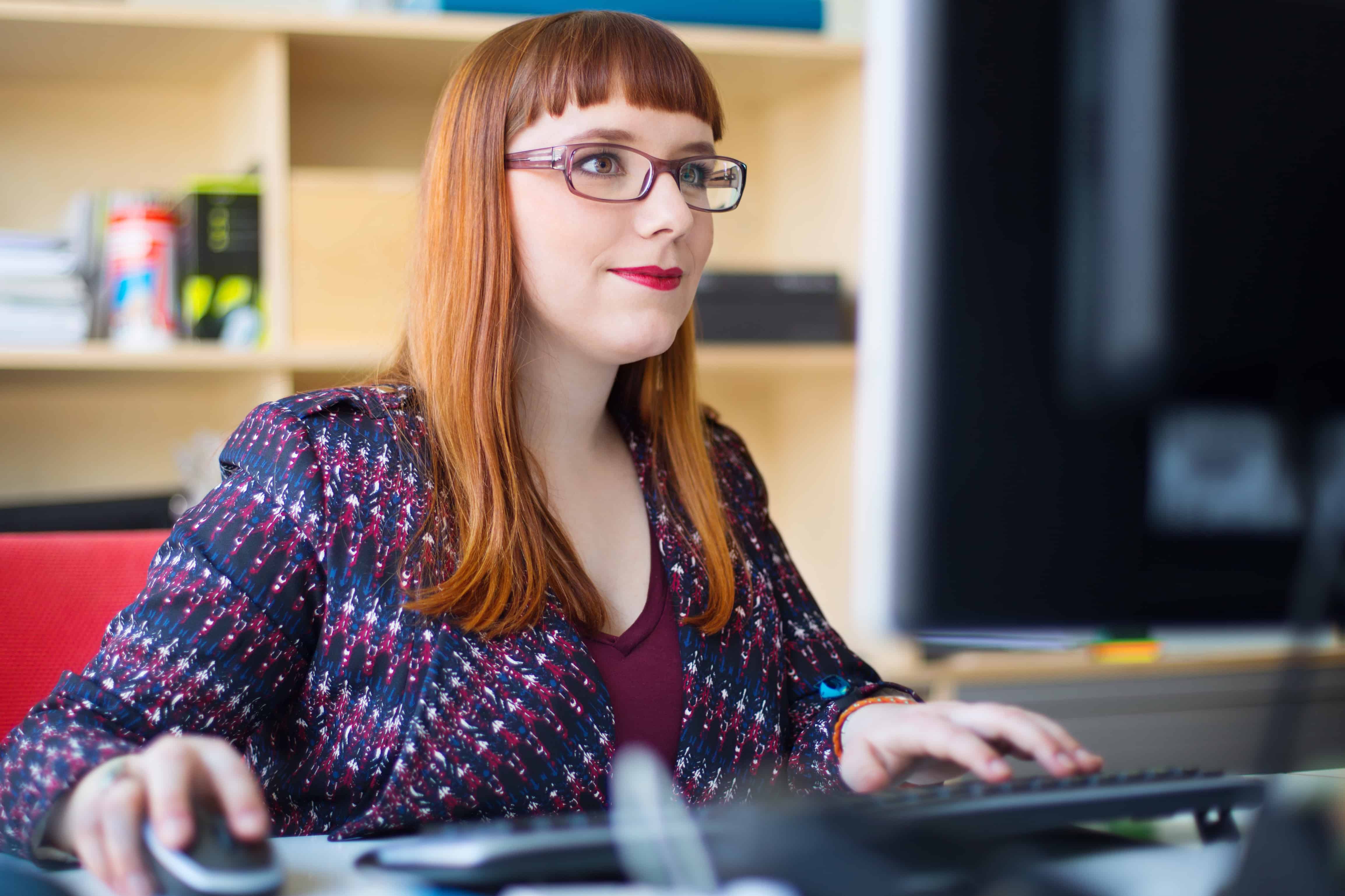 Young woman working at her desk